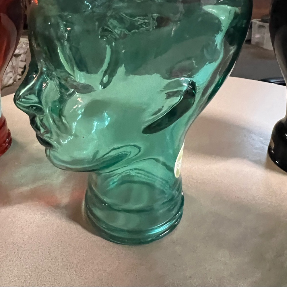 Green glass Mannequin head for displaying hats and scarves made in Spain